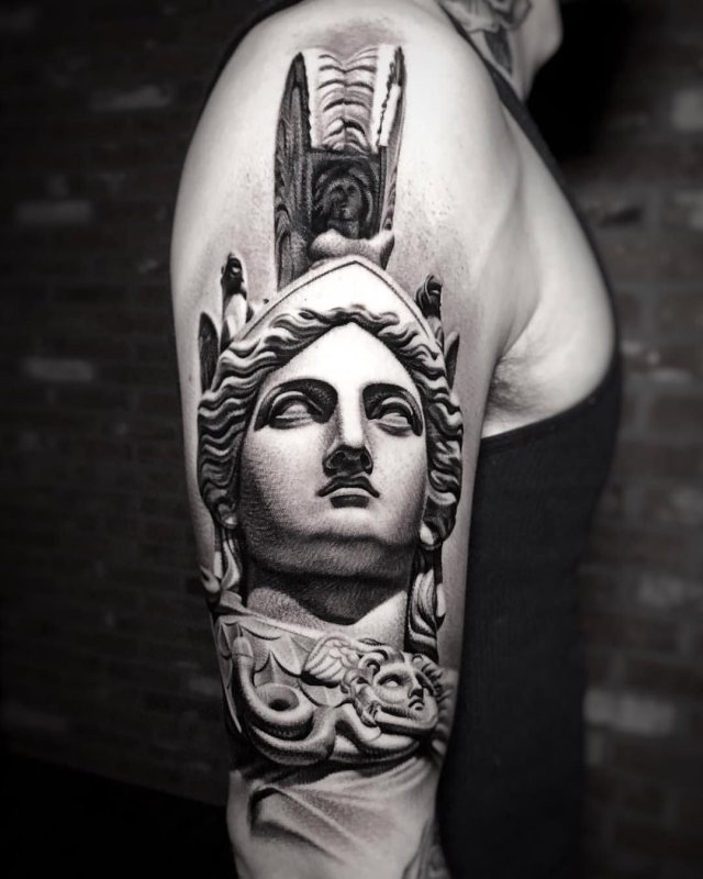 Greek-style tattoo on the shoulder for men