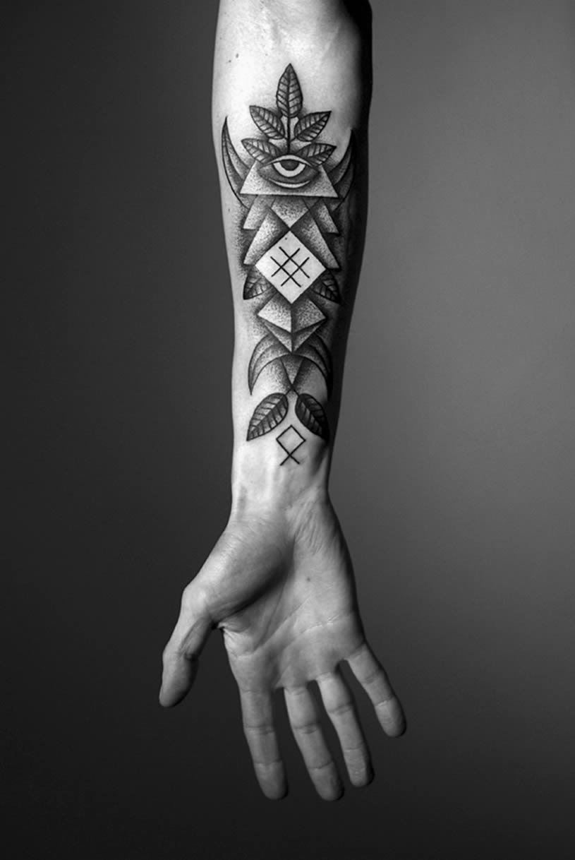 Large tattoo on the forearm for men