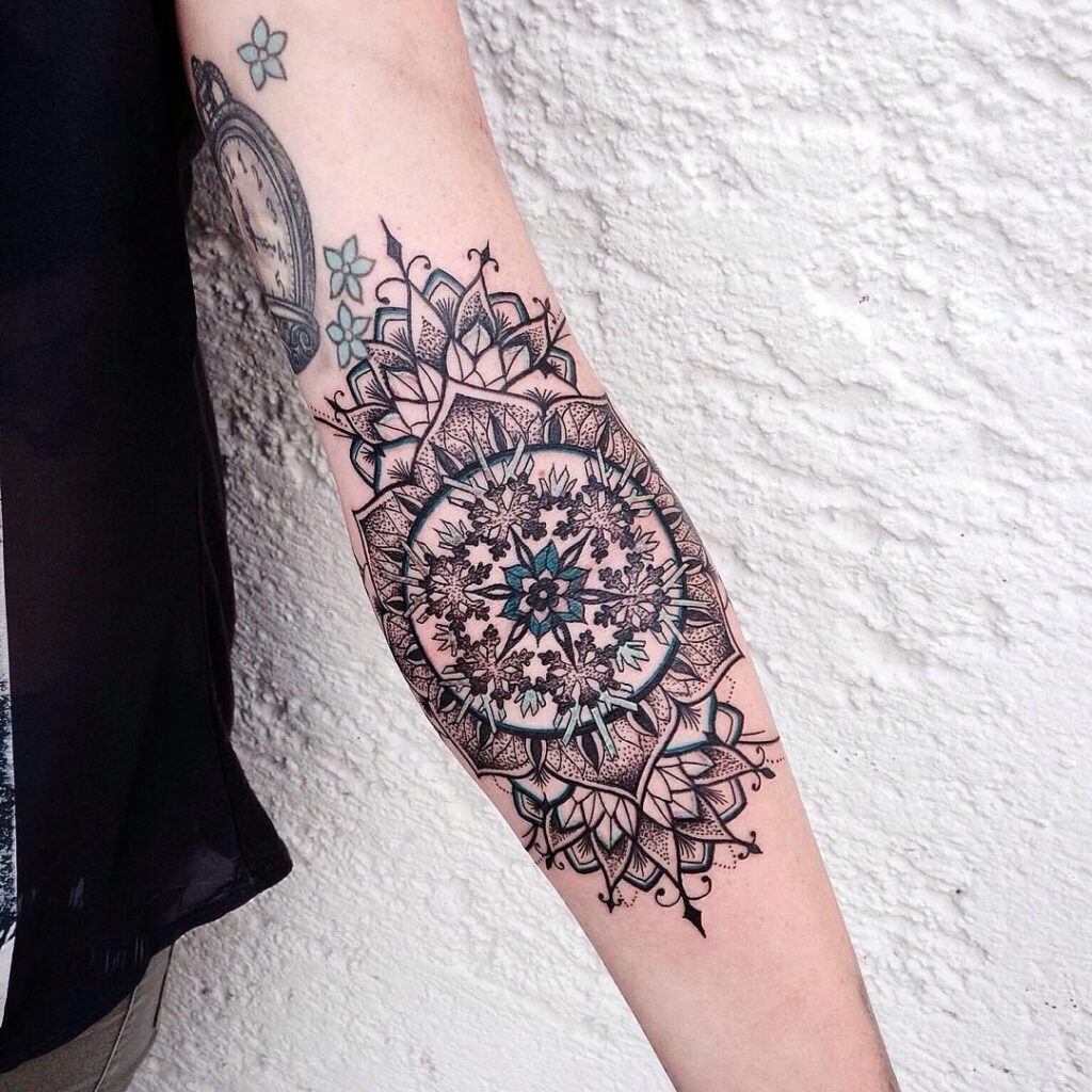 Large tattoo on the forearm for women