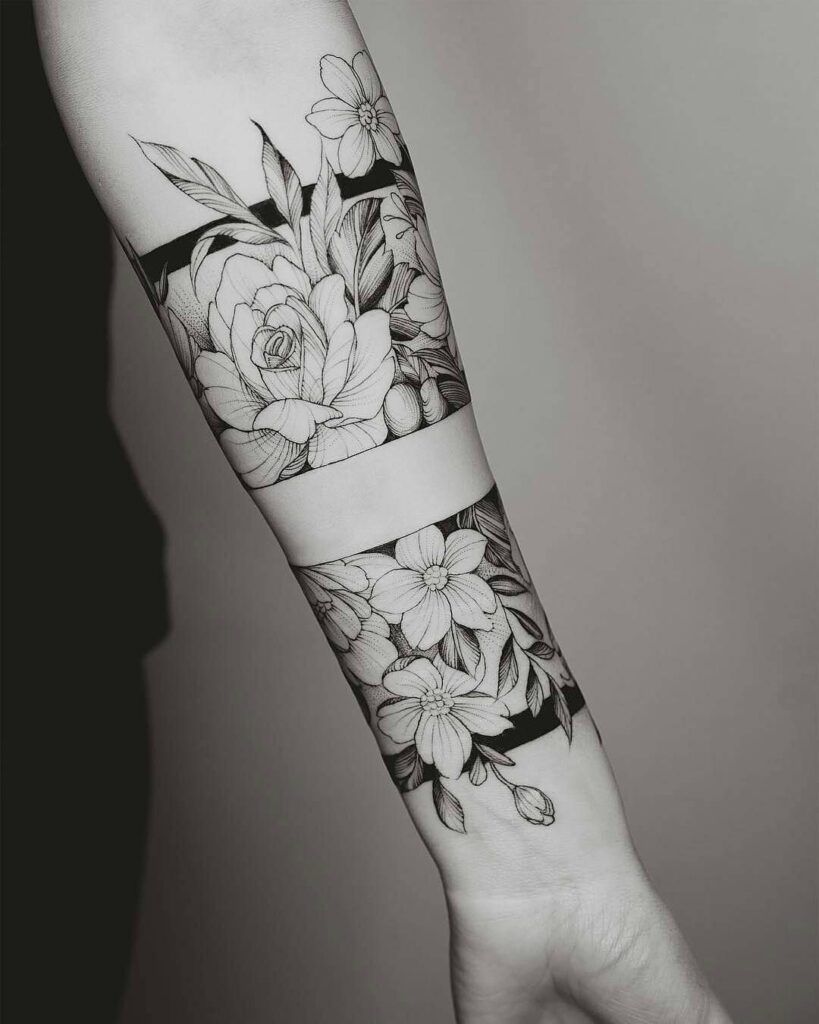 Flower tattoo on the forearm for women