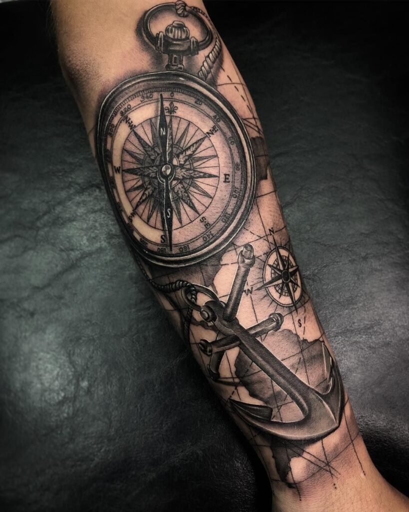 Compass and anchor tattoo on the forearm for men