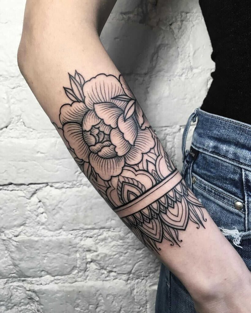 Rose tattoo on forearm for women