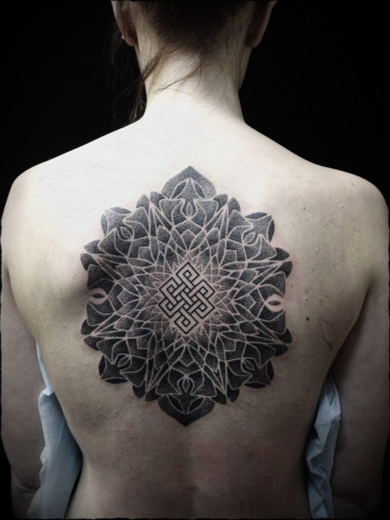 Dotwork tattoo on the back for women