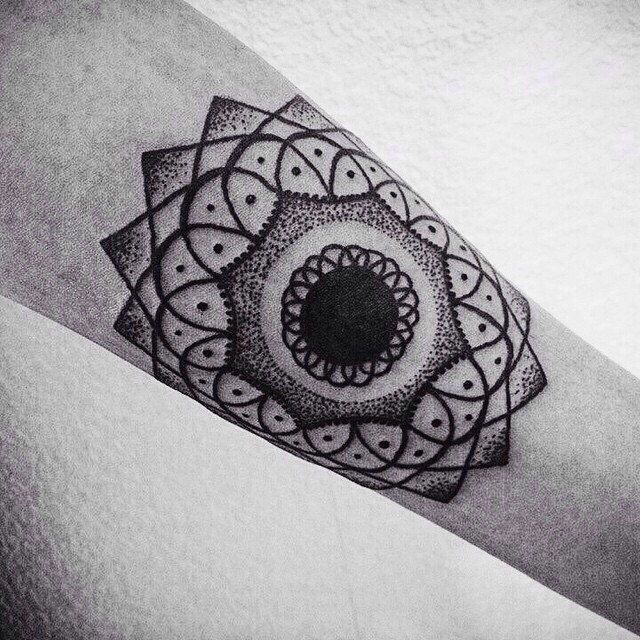 Dotwork tattoo on the arm for women