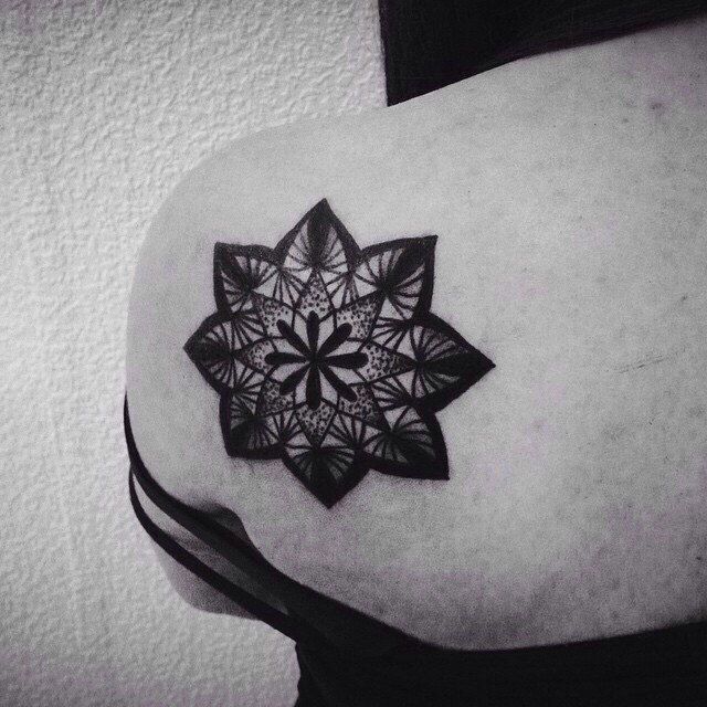 Dotwork tattoo on the shoulder blade for women