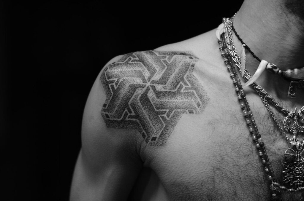 Dotwork tattoo on the shoulder for men