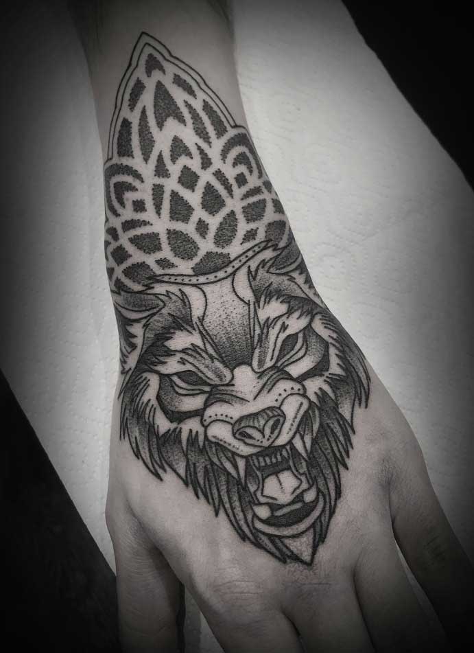 Tattoo in dotwork style on the wrist for men