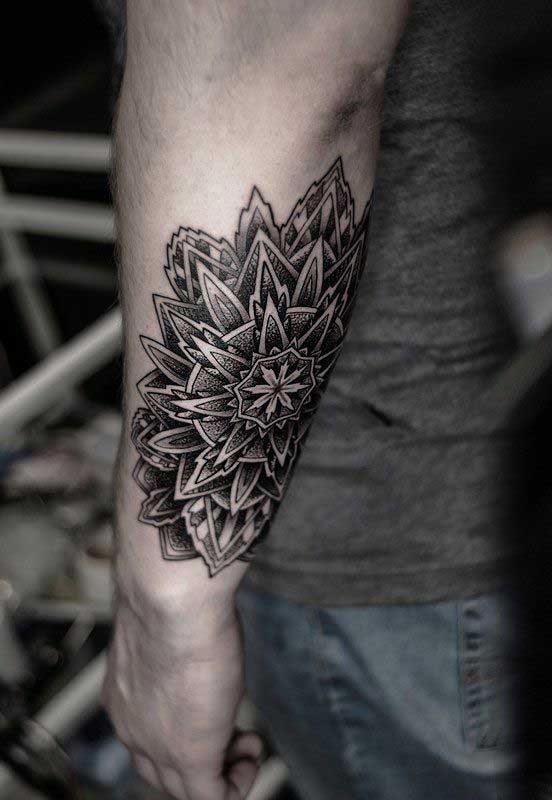 Tattoo in dotwork style on the forearm for men