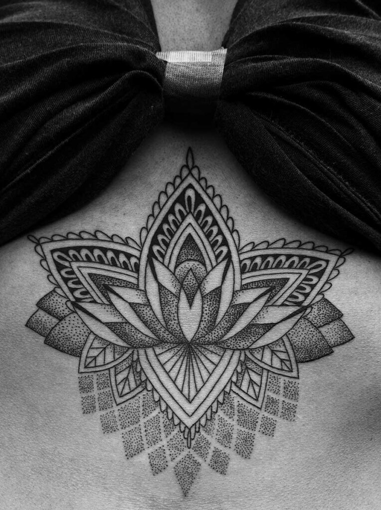 Dotwork tattoo on the back for women