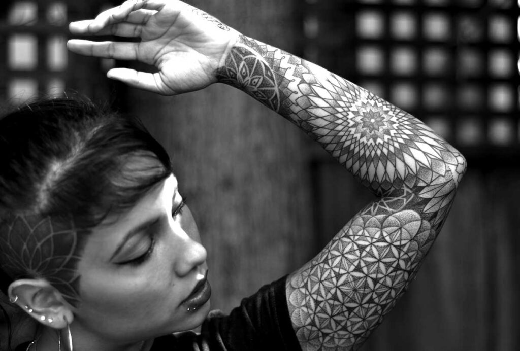 Dotwork tattoo on the arm for women