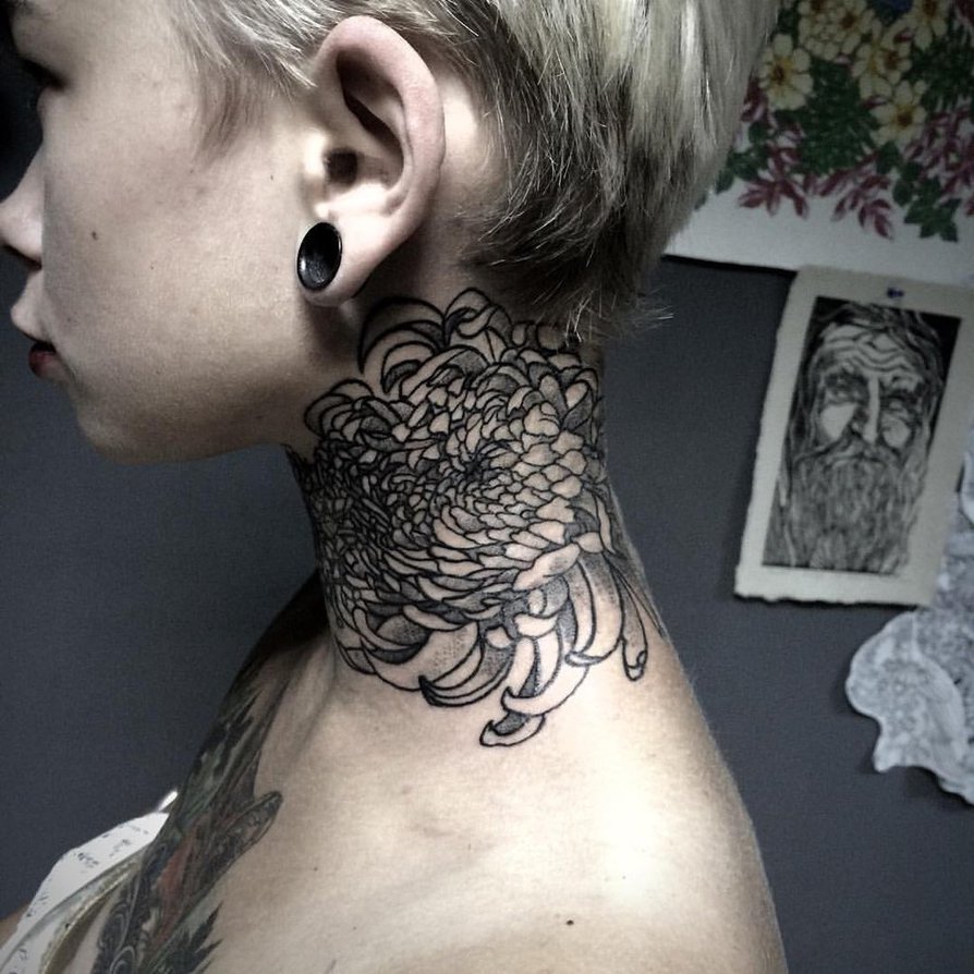 Flower tattoo on the neck for women