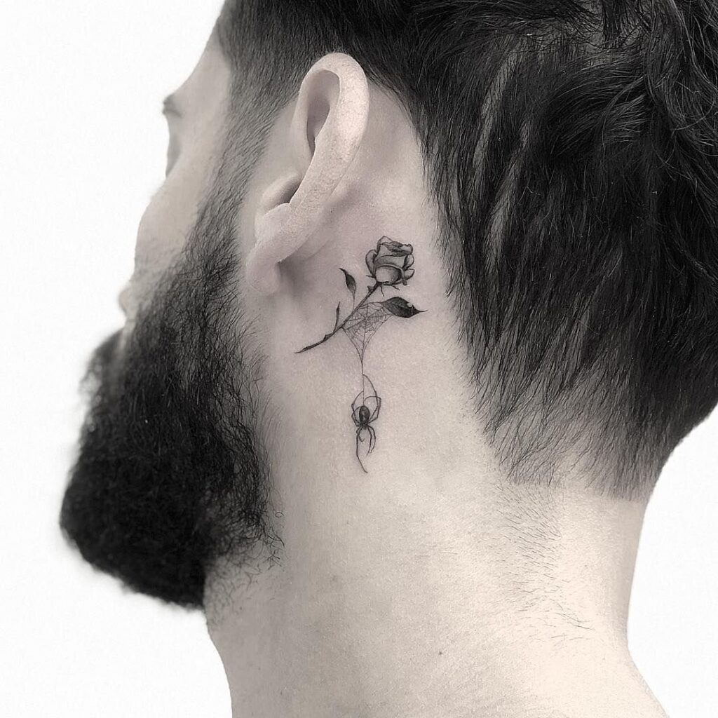 Tattoo of a rose and a spider on the neck for men