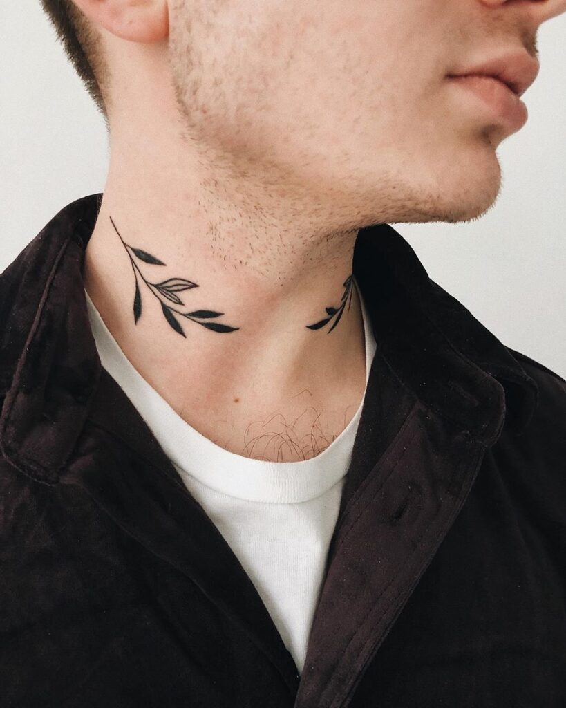 Tattoo of twigs of leaves on the neck for men