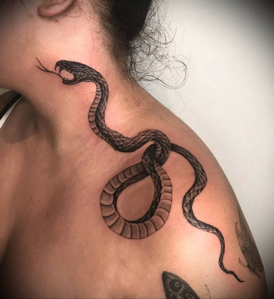 Large snake tattoo on the neck for women