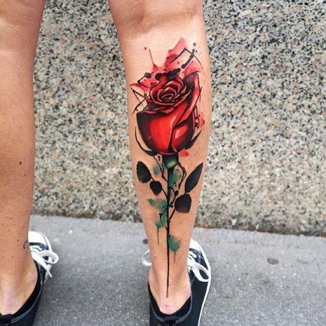 Color rose tattoo on calves for men