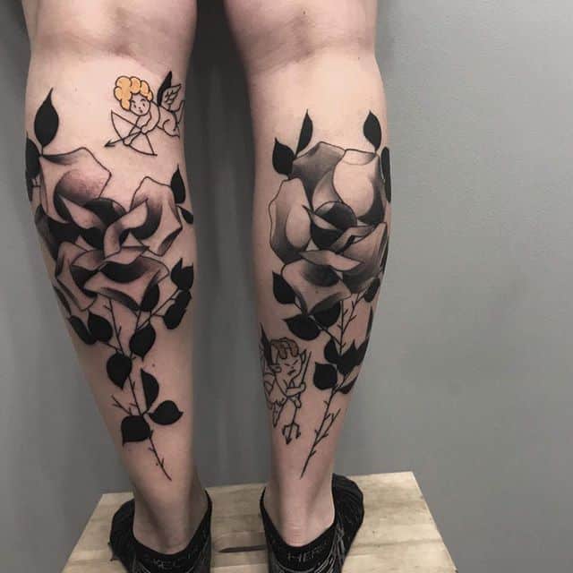 Large rose tattoo on the calf for women