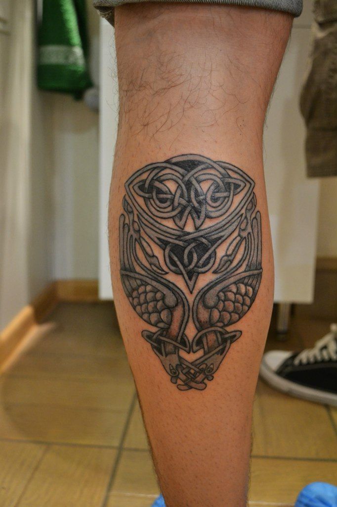 Tattoo of an owl on a calf for men