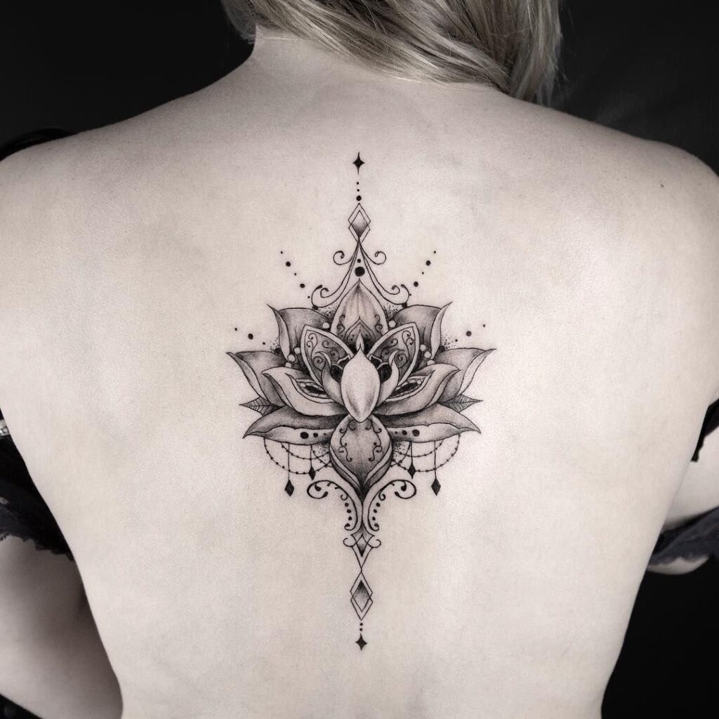 Flower tattoo on the back for women