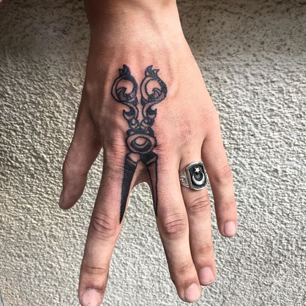 Large scissor tattoo on fingers for men