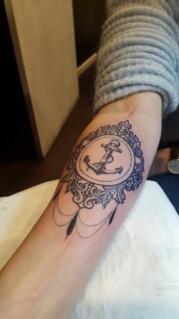 Baroque anchor tattoo on forearm for women