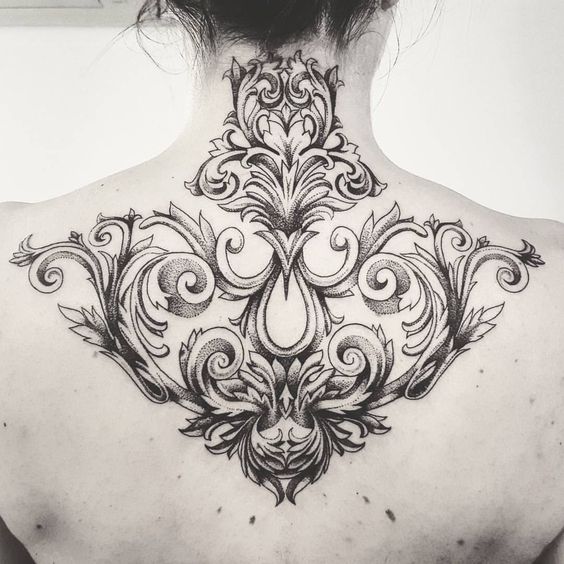 Baroque tattoo on the back for women