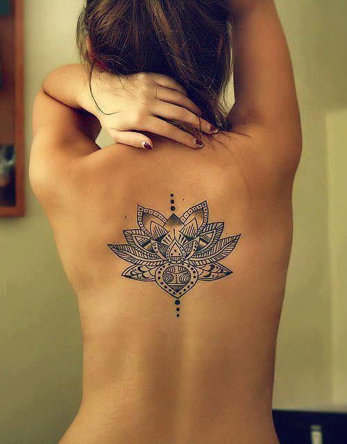 Baroque tattoo on the back for women