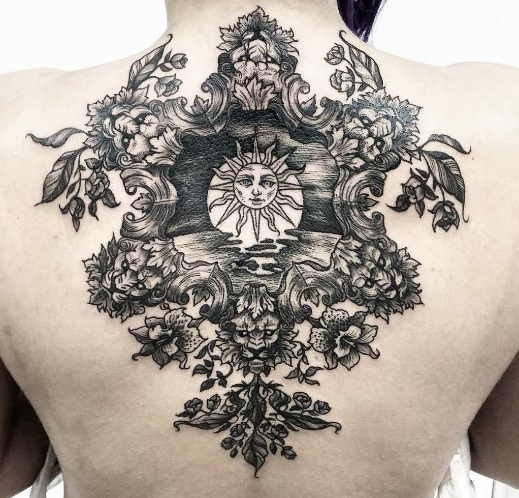 Baroque tattoo on the back for women