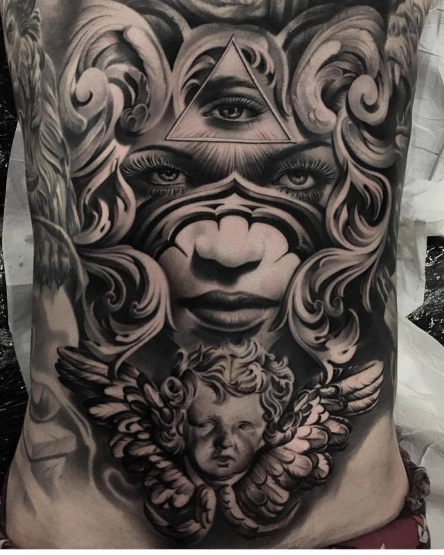 Large baroque tattoo on the abdomen for men