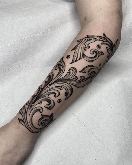 Baroque tattoo on the forearm for men