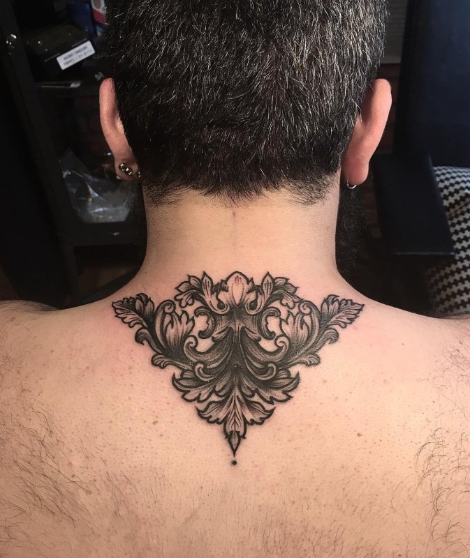 Baroque tattoo on the back for men