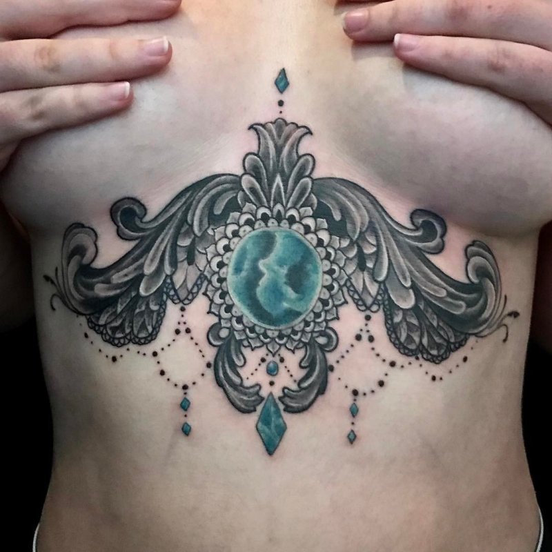 Baroque tattoo on the abdomen for women