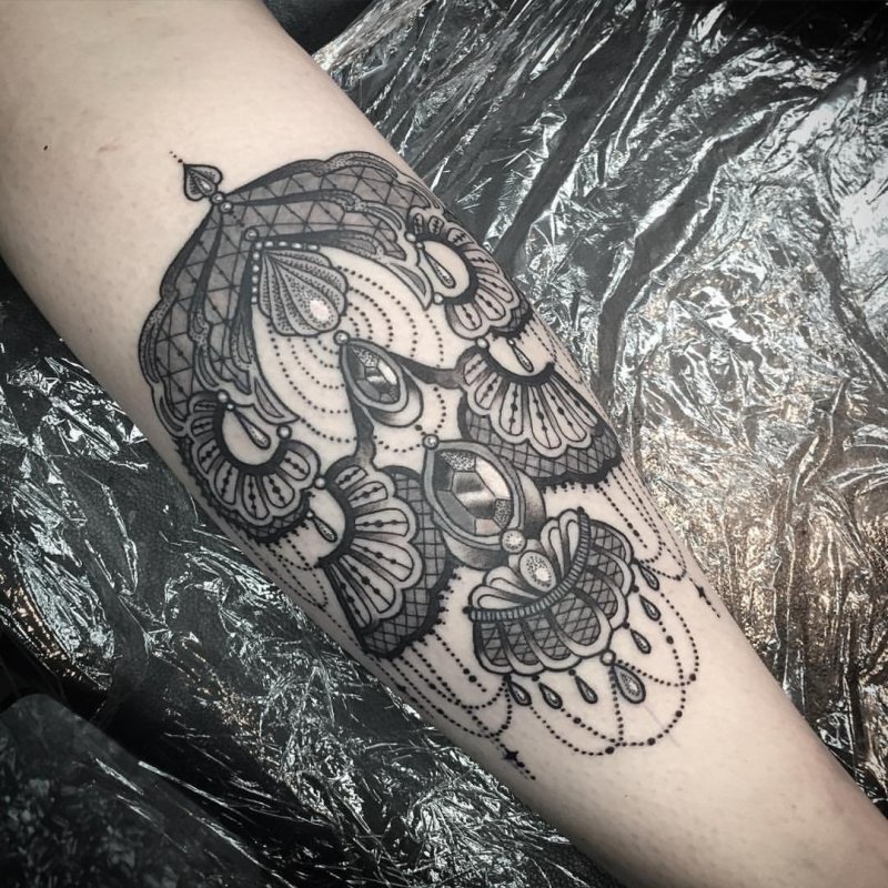 Baroque tattoo on the forearm for men