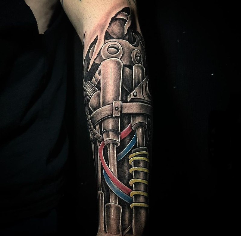 Biomechanics style tattoo on the forearm for men