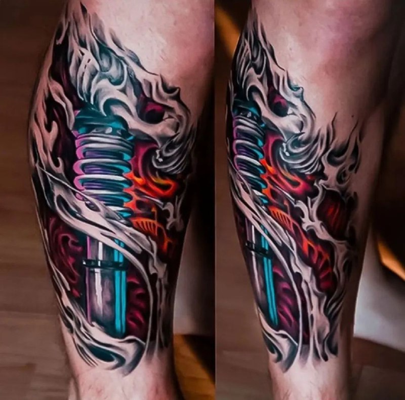 Colored tattoo in the style of biomechanics on the shin for men