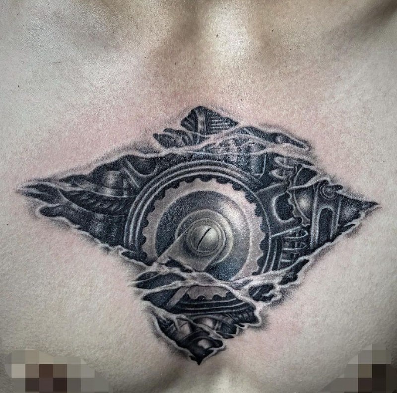 Biomechanics style tattoo on the chest for men