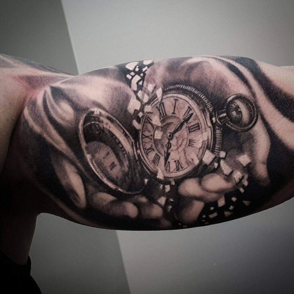 Black&Grey watch tattoo on the biceps for men