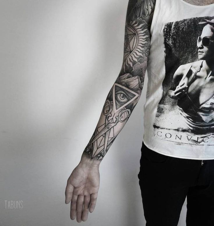 Tattoo on the arm in the style of Black&Grey for men