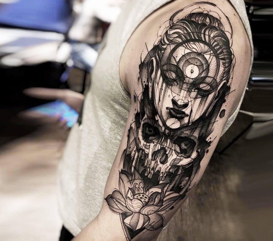 Tattoo of a girl and a skull in Black&Grey style on the shoulder for men