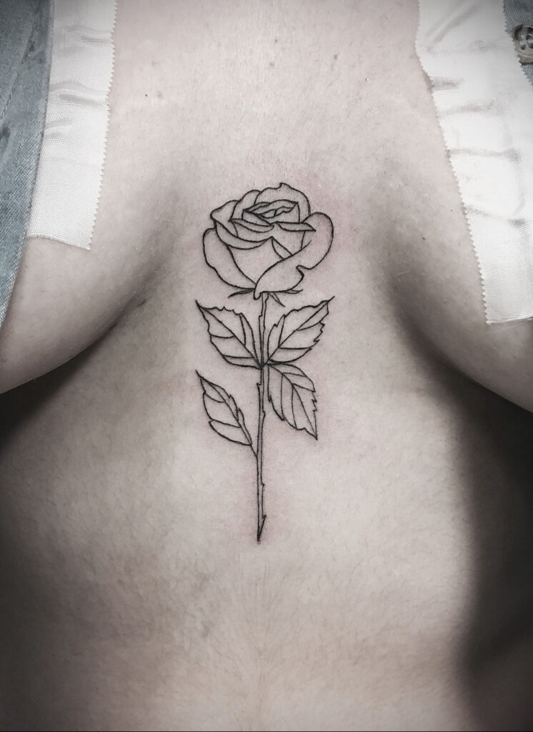 Rose tattoo on the chest for women