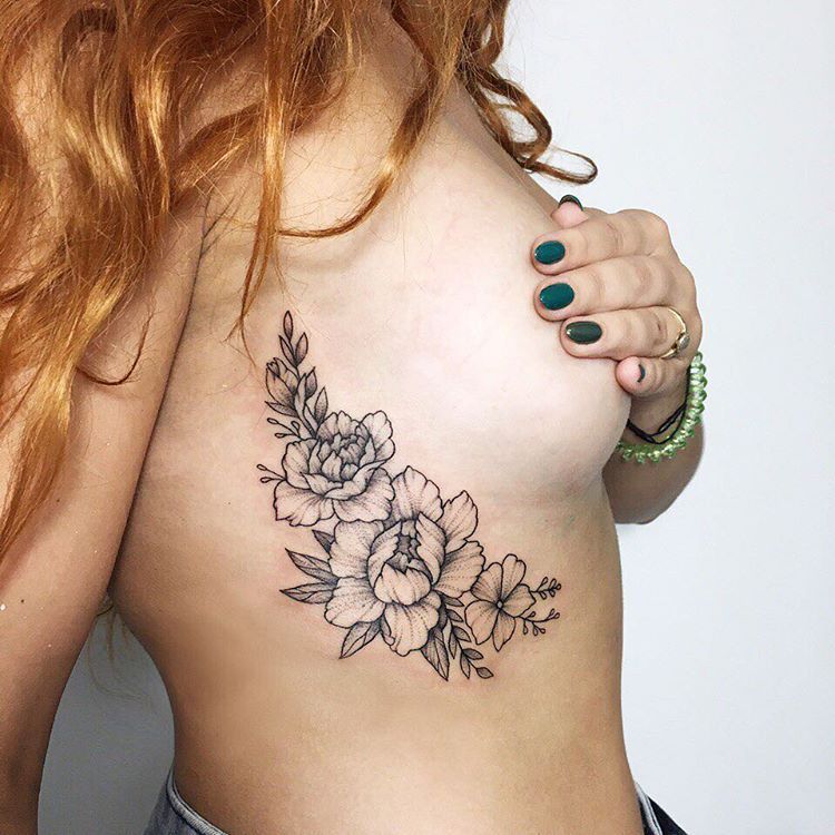 Flower tattoo on the chest for women