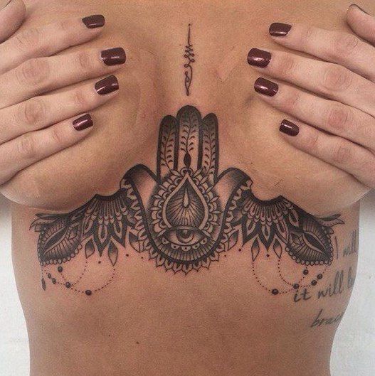 Tattoo of a hams on the chest for women