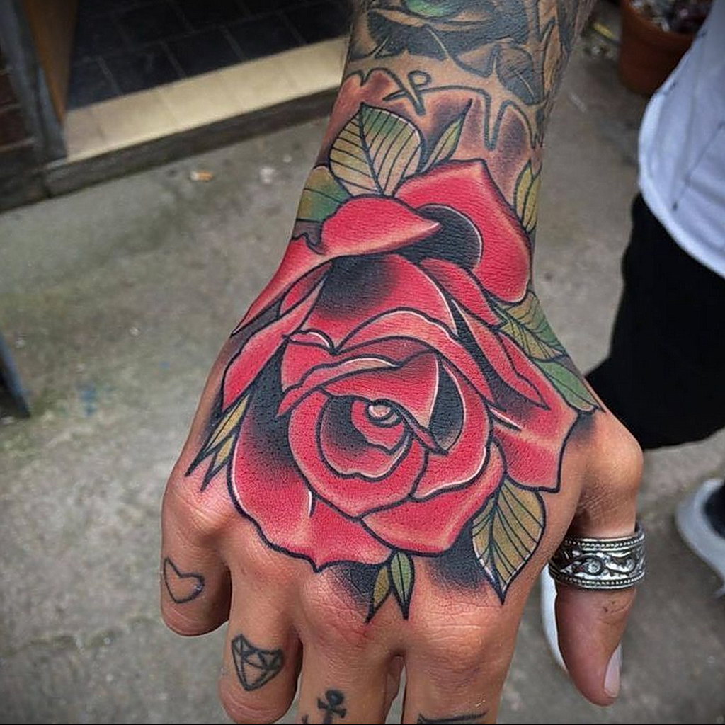 Colorful rose tattoo on the hand for men