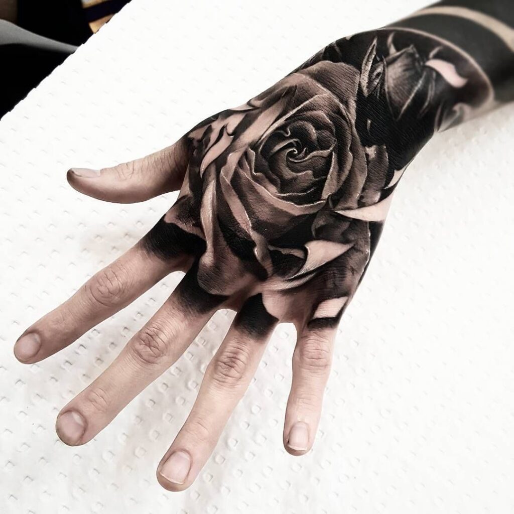 Rose tattoo on the hand for men