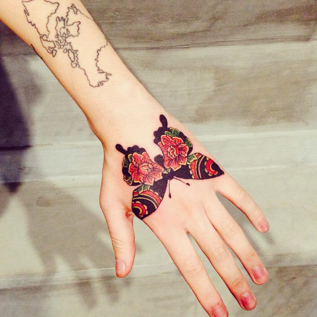 Butterfly tattoo on the hand for women