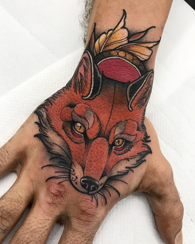 A fox tattoo on the hand for men