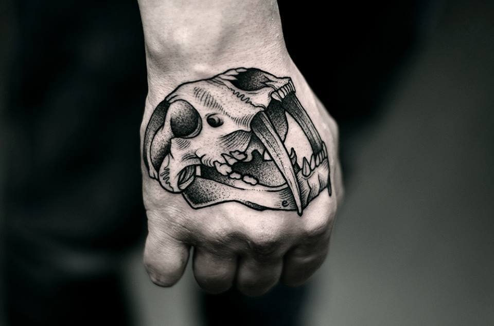 Large skull tattoo on the hand for men