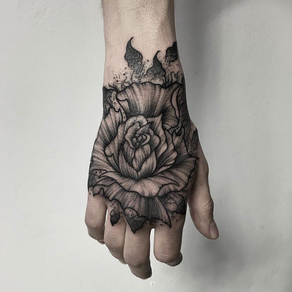 Flower tattoo on the hand for men