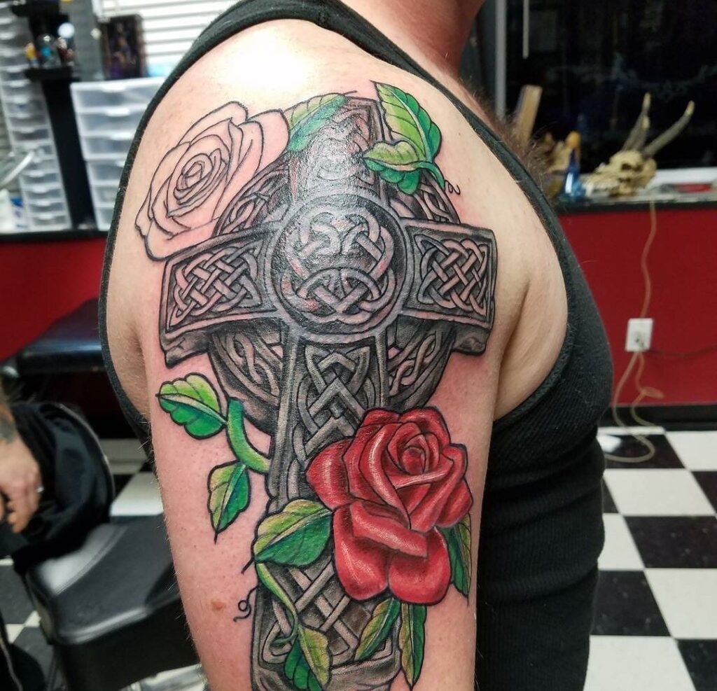 Colored celtic tattoo on the shoulder for men