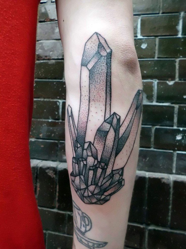 Tattoo in dotwork style on the forearm for men