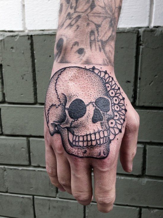 Dotwork skull tattoo on the hand for men